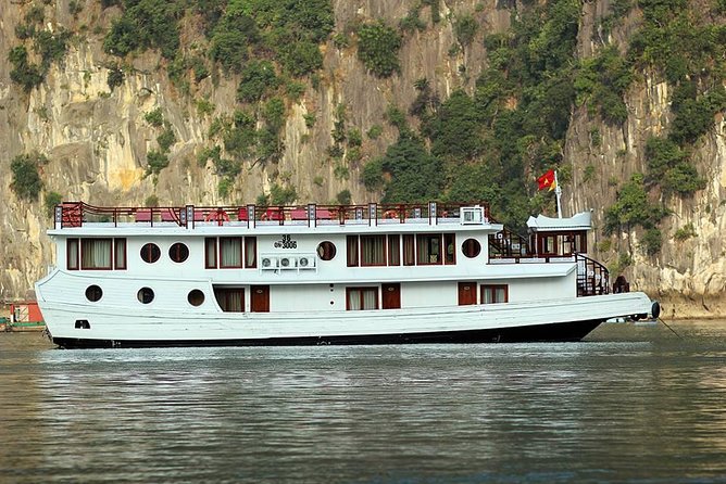 2-Day Oriental Sails Junk Cruise of Halong Bay - Day 1: Sung Sot Cave, Ti Top climb, and sunset happy-hour energy