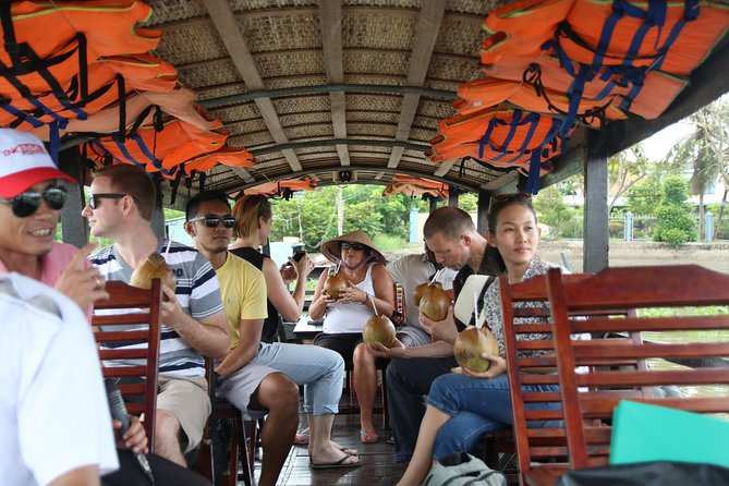 Cai Be Mekong Delta Tour: Cooking Class, Cycling & Craft Villages - Craft village time in Cai Be: candies, popcorn, and family work