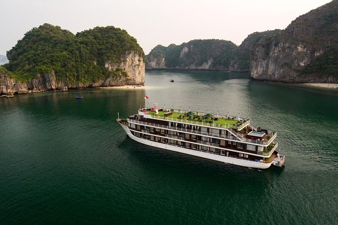 Doris Cruise 5 star cruise 2 days visiting Halong Bay Lan Ha Bay private balcony - Day 2 at sunrise: tai chi on the sundeck, then Dark & Bright cave