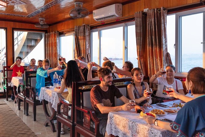 Halong Bay Day Tour With Titop Island, Cave, Kayak & Lunch - Titop Island: 400 steps for views, beach time for recovery