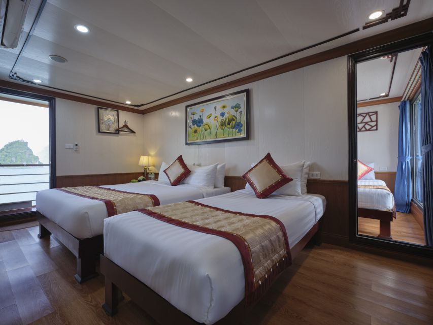 Hanoi: 2-Day Ha Long Bay 4-Star Cruise with Titov Cave - Sunset party, spring-roll cooking, and squid fishing at night
