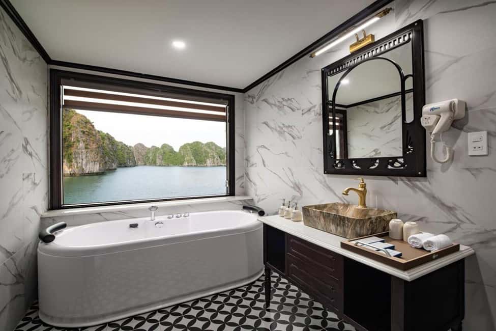 Hanoi: 2-Day Ha Long Bay 4-Star Cruise with Titov Cave - Day 2: sunrise on deck, tea or coffee, and Sung Sot Cave