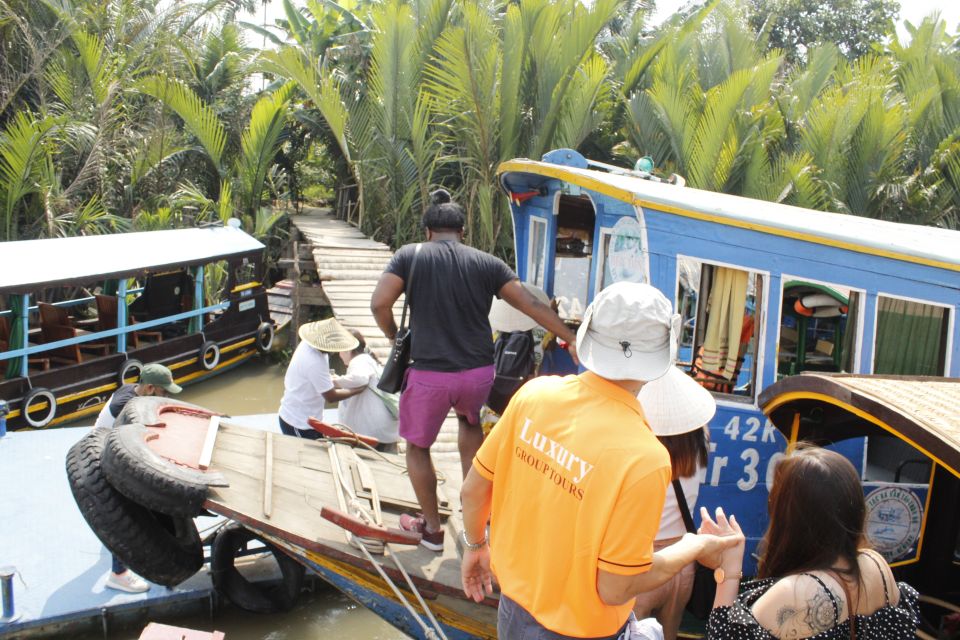 HCM: Mekong Delta, My Tho & Ben Tre Coconut Village - Coconut-lined canals on a hand-rowed sampan