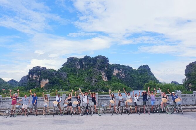 Highlight Ninh Binh Full Day Tour Tam Coc Boat, Mua Cave, Hoa Lu - The Comfort Package: Pickup, Wi-Fi, Buffet Lunch, and Modern Bus Time