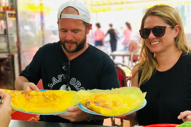 Ho Chi Minh City Street Food Tour & Sightseeing By Motorbike - What you actually see: markets, monuments, and apartment life