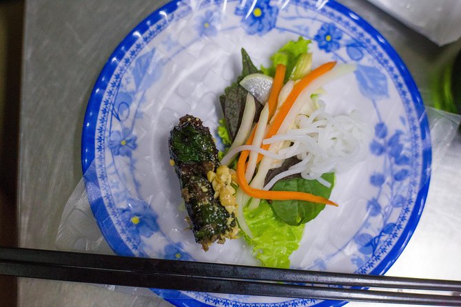 Private Street Food Evening Walking Tour in Ho Chi Minh City - The middle stops: bo la lot, noodle soups, and seafood alleys