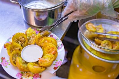 Private Street Food Evening Walking Tour in Ho Chi Minh City - Stop 1: leaving the tourist zone for banh xeo and banh khot