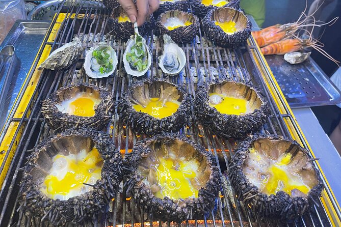 Saigon By Night and Street Food By Motorbike | Opt: Ao Dai Riders - Getting Picked Up at 5:30 PM: Your Night Starts Smooth